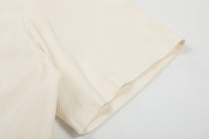 DAXUEN Asymmetrical collar short-sleeve top in cream and black
