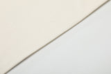DAXUEN Asymmetrical collar short-sleeve top in cream and black