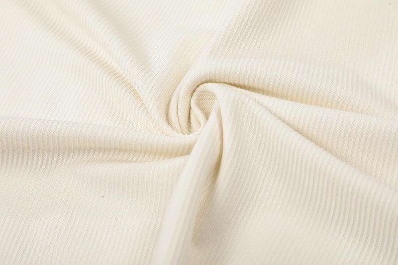 DAXUEN Asymmetrical collar short-sleeve top in cream and black