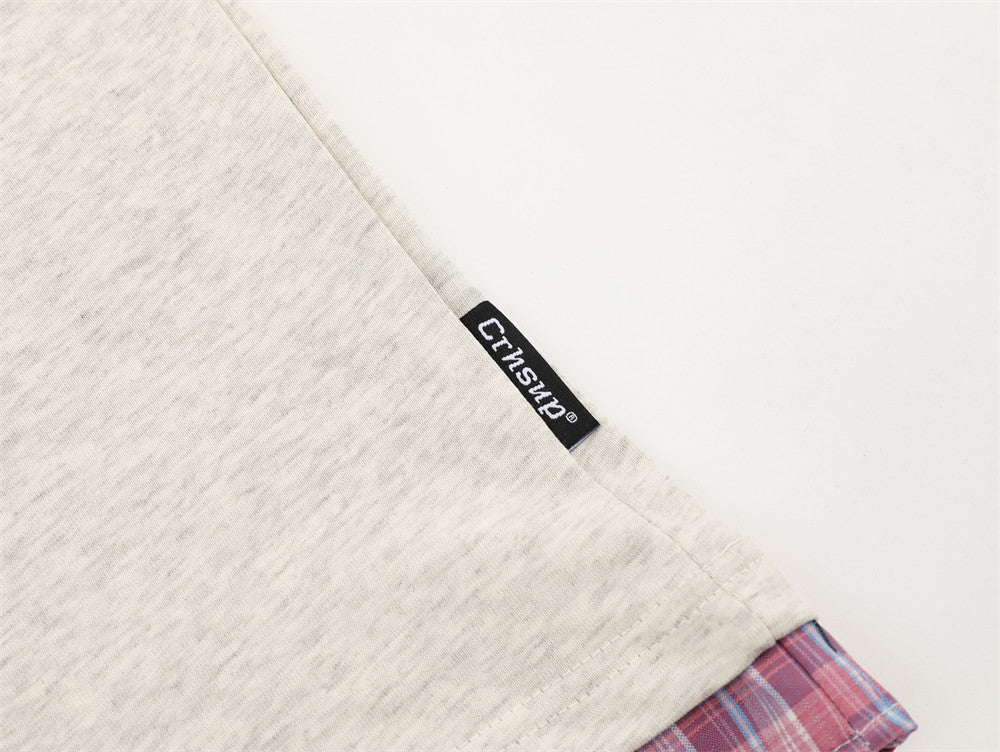 DAXUEN Layered polo shirt with cartoon graphics and plaid accents