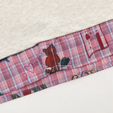 DAXUEN Layered polo shirt with cartoon graphics and plaid accents