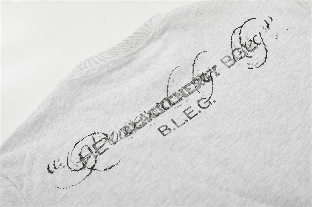 DAXUEN Short-sleeved graphic T-shirt with distressed flag design