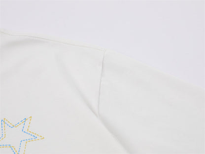 DAXUEN Playful apple graphic T-shirt with bear design