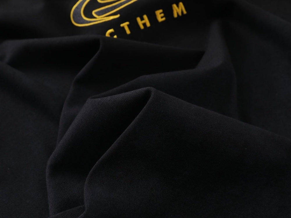DAXUEN Bold oversized t-shirt with graphic embroidery and studs