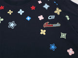 DAXUEN Colorful graphic oversized T-shirt with clover and star designs
