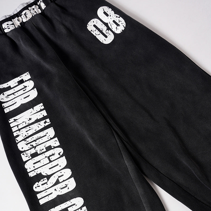 DAXUEN Distressed wide-leg sweatpants in black and grey