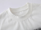 DAXUEN Distressed oversized T-shirt with heart graphic