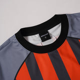DAXUEN Multi-panel short-sleeved t-shirt in grey, black, and orange