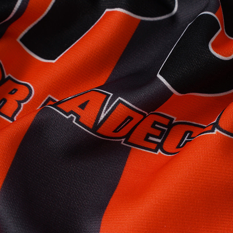 DAXUEN Multi-panel short-sleeved t-shirt in grey, black, and orange
