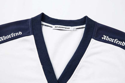 DAXUEN Oversized V-neck T-shirt with contrasting panels and graphics