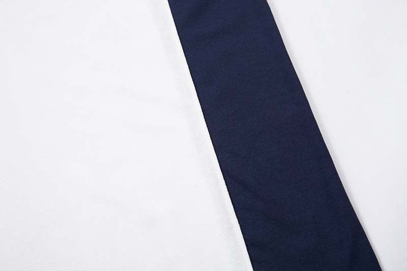 DAXUEN Oversized V-neck T-shirt with contrasting panels and graphics