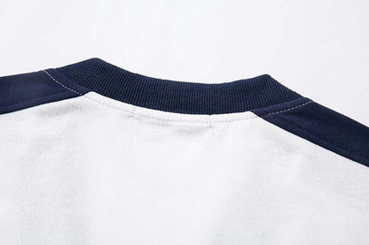 DAXUEN Oversized V-neck T-shirt with contrasting panels and graphics
