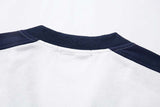 DAXUEN Oversized V-neck T-shirt with contrasting panels and graphics