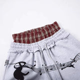 DAXUEN Grey wide-leg sweatpants with musical print and plaid details