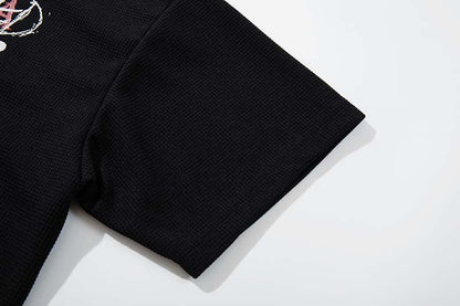 DAXUEN Black short-sleeved t-shirt with distressed graphic design