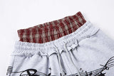 DAXUEN Grey wide-leg sweatpants with musical print and plaid details