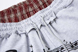 DAXUEN Grey wide-leg sweatpants with musical print and plaid details
