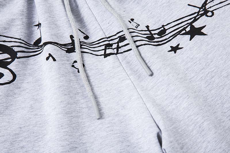 DAXUEN Grey wide-leg sweatpants with musical print and plaid details