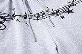 DAXUEN Grey wide-leg sweatpants with musical print and plaid details