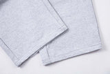 DAXUEN Grey wide-leg sweatpants with musical print and plaid details