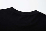 DAXUEN Black short-sleeved t-shirt with distressed graphic design
