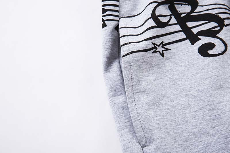 DAXUEN Grey wide-leg sweatpants with musical print and plaid details