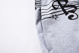 DAXUEN Grey wide-leg sweatpants with musical print and plaid details