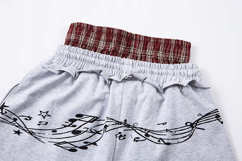DAXUEN Grey wide-leg sweatpants with musical print and plaid details