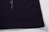 DAXUEN Black short-sleeved polo shirt with graphic print