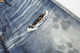 DAXUEN Distressed wide-leg jeans with tiger stripe pattern