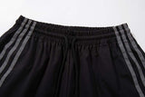 DAXUEN Wide-leg track pants in solid colors