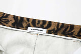 DAXUEN Distressed wide-leg jeans with tiger stripe pattern