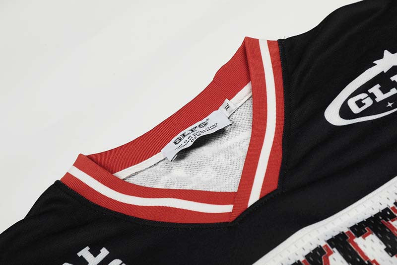 DAXUEN Black and white graphic V-neck t-shirt with red accents