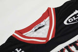 DAXUEN Black and white graphic V-neck t-shirt with red accents