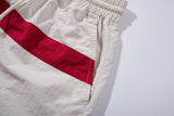 DAXUEN Wide-leg pants with red cross graphic and adjustable drawstrings