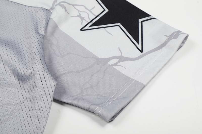 DAXUEN Distressed V-neck short sleeve top with graphic print