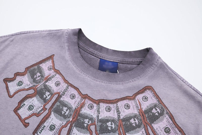 DAXUEN Washed oversized graphic t-shirt with dollar bills and 'misery' print