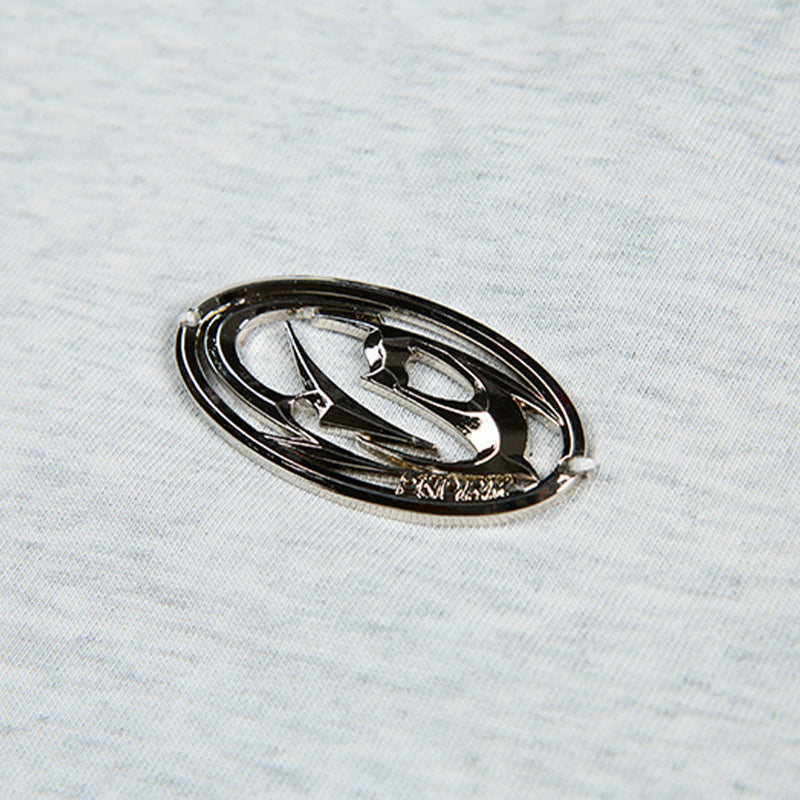 DAXUEN Short-sleeved T-shirt with metallic emblem and pleated details