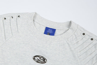 DAXUEN Short-sleeved T-shirt with metallic emblem and pleated details
