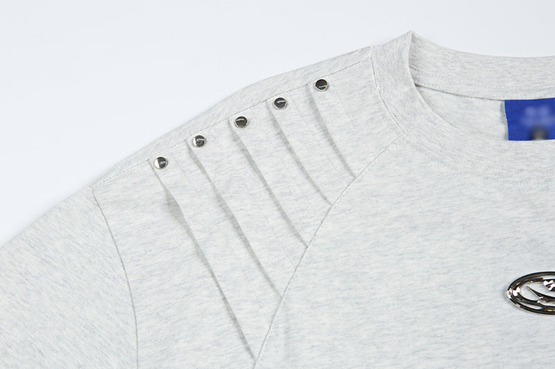 DAXUEN Short-sleeved T-shirt with metallic emblem and pleated details