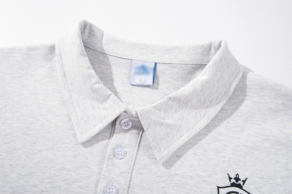 DAXUEN Graphic polo shirt with crest emblem and text