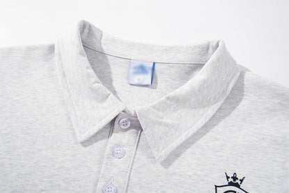 DAXUEN Graphic polo shirt with crest emblem and text