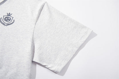 DAXUEN Graphic polo shirt with crest emblem and text