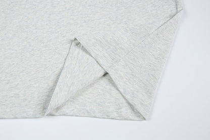 DAXUEN Short-sleeved T-shirt with metallic emblem and pleated details