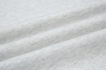 DAXUEN Short-sleeved T-shirt with metallic emblem and pleated details