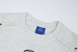 DAXUEN Distinctive short-sleeved T-shirt with emblem and pleated panels