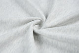 DAXUEN Distinctive short-sleeved T-shirt with emblem and pleated panels