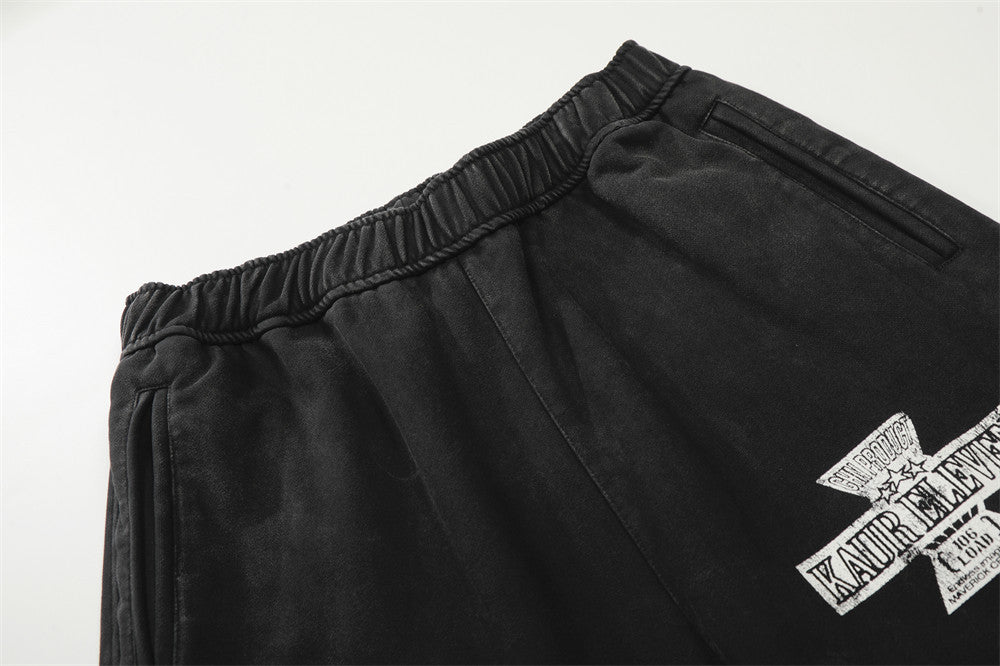 DAXUEN Distressed wide-leg sweatpants with graphic print