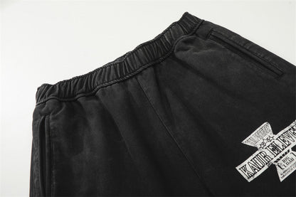 DAXUEN Distressed wide-leg sweatpants with graphic print