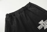 DAXUEN Distressed wide-leg sweatpants with graphic print